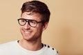 Hes got a carefree outlook on life.... Studio headshot of a stylishly-dressed young man smiling and wearing glasses. Royalty Free Stock Photo