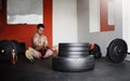 Hes got his mind set on achieving his goals. Full length shot of a handsome and muscular young man pulling weights in Royalty Free Stock Photo