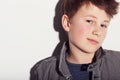 Hes got plenty of confidence. Young adolescent boy looking confident against a white background. Royalty Free Stock Photo