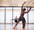 Hes got talent. Rearview shot of a male dancer performing before a judge during an audition.