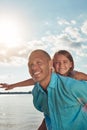 Hes the greatest Dad. a middle-aged man and his young daughter spending some quality time at the beach. Royalty Free Stock Photo