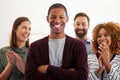 Hes a leader you want to follow. Portrait of a team of colleagues standing in an office and clapping. Royalty Free Stock Photo