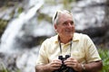 Hes always loved being in nature. a senior man with binoculars looking at the scenery. Royalty Free Stock Photo