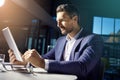 Hes not afraid of working overtime. a businessman using a digital tablet while woking late at the office. Royalty Free Stock Photo