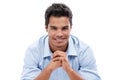 Hes one confident character. Studio shot of a handsome young man sitting in a studio isolated on white. Royalty Free Stock Photo