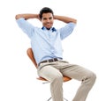 Hes one confident character. Studio shot of a handsome young man sitting in a studio isolated on white. Royalty Free Stock Photo