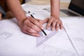 Hes a skilled draftsman. a draftsman drawing up building plans using a triangle. Royalty Free Stock Photo