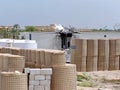 Blast barriers around a damaged trailer on a military camp in Iraq Royalty Free Stock Photo