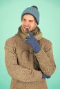 Hesitating and doubtful. Man handsome unshaven guy wear winter accessories. Winter season sale. Hipster knitted winter Royalty Free Stock Photo