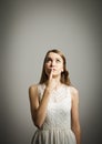 Hesitation. Young woman in white.