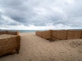 Hessian type fence biodegradable matting retaining sand to protect nearby houses, property from encroachment. Instow, north Devon Royalty Free Stock Photo