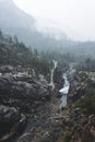 Fogs Among Trees, Dam, and Mountains on a Rainy Day in Hetch Hetchy Reservoir Area in Yosemite National Park, California Royalty Free Stock Photo