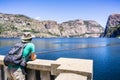 Hetch Hetchy reservoir on a sunny summer day; Wapama and Tueeulala Falls visible in on the far side of the lake; Yosemite National