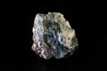HEULANDITE stone is a green mineral on a dark background
