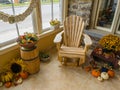 HEUVELTON NY / USA - NOVEMBER 09, 2019: Storefront Display Featuring Mums, Harvest items, and Muskoka Chair, November 09, 2019