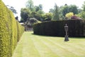 Hever castle garden's path, hedges, & urn in England