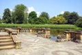 Hever castle garden's patio wih steps at a lakeside in England Royalty Free Stock Photo