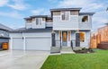 Hew luxury home exterior featuring three Car Garages, Royalty Free Stock Photo