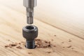 Hex bolt screw hex bit  in wooden oaks plate. Spanner, bolt, screw and nuts Royalty Free Stock Photo