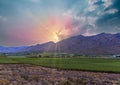 Hex River valley wine farms and mountains with sun rays behind the cloud