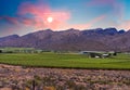 Hex River valley wine farms and mountains with sunset