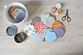 Hexagon english paper piecing templates, white cup, thread, retro scissors and metal pins