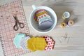 Hexagon patchwork templates, white cup, thread, retro scissors, metal pins and quilting ruler