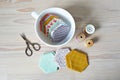 Hexagon patchwork templates, white cup, thread and retro scissors