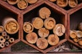 Hexagonal beehives of bamboo and wood stacked on top of each other.
