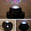 Hexagonal black LED projection device displays multicolored patterns on walls. The Royalty Free Stock Photo