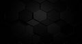 Hexagonal black tiles form a seamless pattern, each with a smooth, matte finish. The Royalty Free Stock Photo