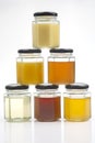 Hexagonal jars with different types and colors of fresh flower honey. vitamin food for health and life