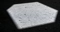Hexagonal light patch on concrete in black and white Royalty Free Stock Photo