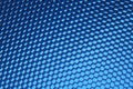 Hexagonal mesh on a blue background.