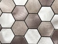Hexagonal metal tile pattern with brushed texture in silver and bronze shades Royalty Free Stock Photo