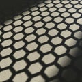 A hexagonal pattern cast as a shadow on a light-colored surface, creating a Royalty Free Stock Photo