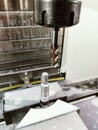 Hexagonal punch making on CNC milling machine with end mill cutter Royalty Free Stock Photo