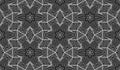 Hexagonal seamless pattern of white lines on black. Ceremonial repeatable ornament in moire style