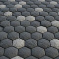 Hexagonal stone tiles arranged in an alternating pattern of dark and light gray. The Royalty Free Stock Photo