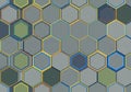 Hexagonal tiles in a geometric pattern create a complex mosaic. Each tile features Royalty Free Stock Photo