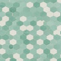 Hexagonal tiles in a mosaic pattern are arranged in alternating shades of green and Royalty Free Stock Photo