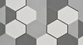 Hexagonal tiles in shades of gray and white form an interlocking pattern. The tiles have a smooth Royalty Free Stock Photo