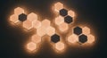 Hexagonal wall lights arranged in a geometric pattern create a modern Royalty Free Stock Photo