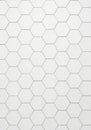 Hexagonal white tiles arranged in a honeycomb pattern. Each hexagon is bordered with Royalty Free Stock Photo