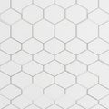 Hexagonal white tiles create a seamless, geometric pattern. Each tile is uniformly shaped with Royalty Free Stock Photo