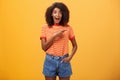 Hey awesme copy space there. Portrait of impressed and surprised enthusiastic young african american female with afro