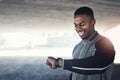 Hey I beat my previous best. a handsome young man checking his watch while exercising outside. Royalty Free Stock Photo