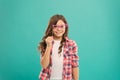 Hey just have fun. Funny small girl holding glasses photo booth props on stick. Cute kid with fancy party props. Party