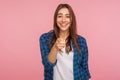 Hey, we need you! Portrait of cheerful pretty girl in checkered shirt with toothy smile pointing to camera