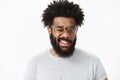 Hey smile. Portrait of optimistic and joyful handsome african american guy in good mood winking at camera friendly and